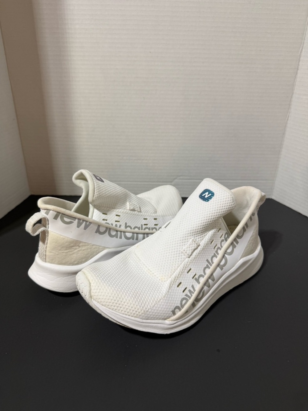 New Balance Slip-On Athletic Sneakers in White with Blue Logo